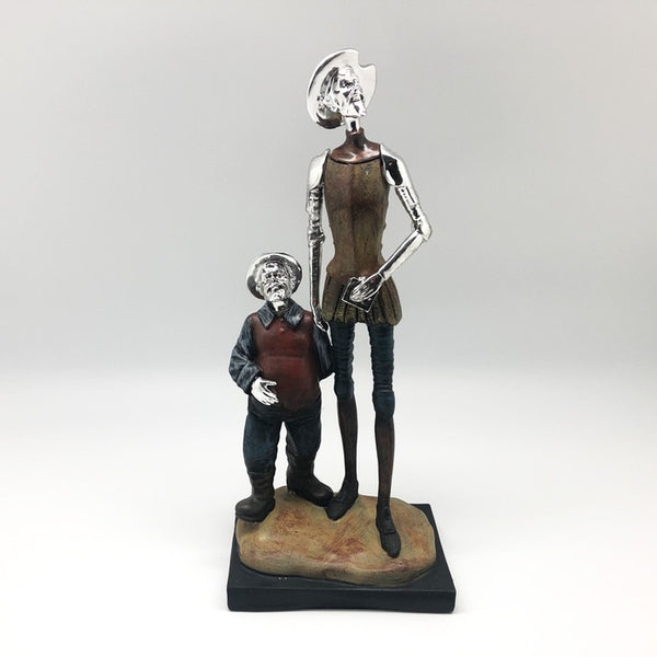 Figura Don Quijote con libro y Sancho Panza